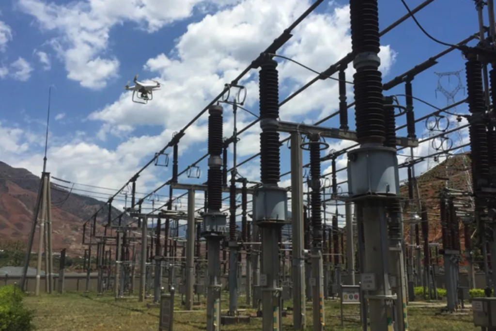 Enterprise drone conducting an aerial inspection inside a high-voltage electrical substation.