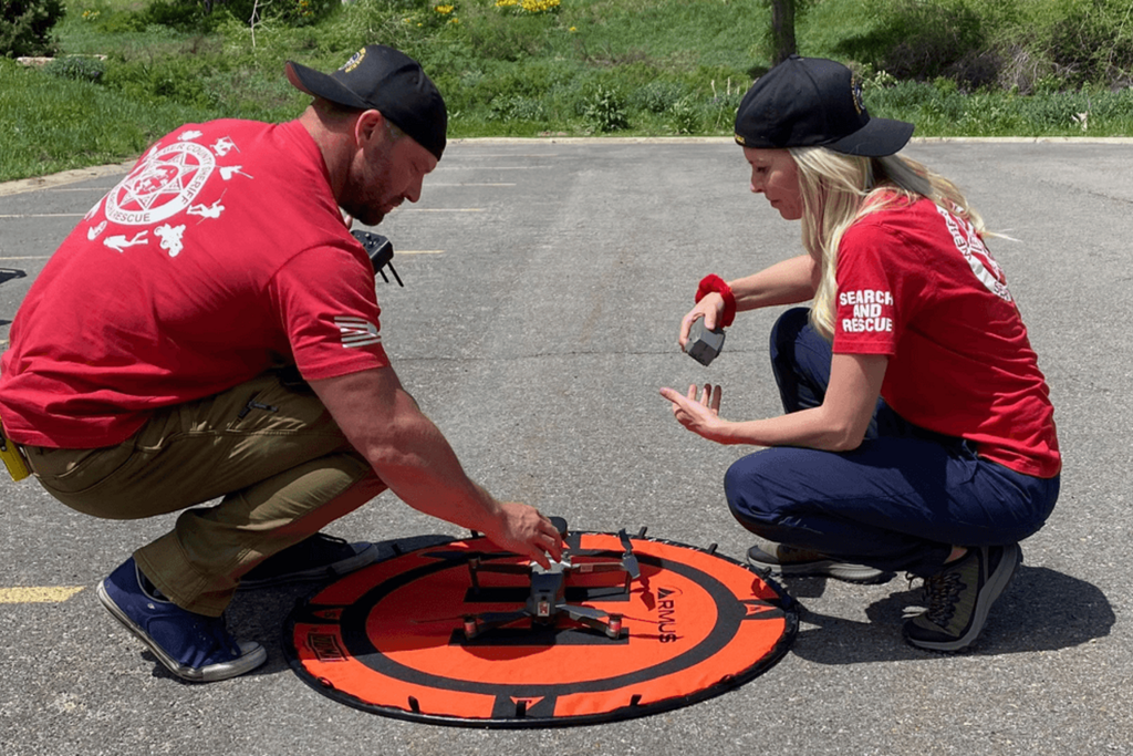 Two RPAS crew members completing a coordinated pre-flight inspection of an enterprise drone.